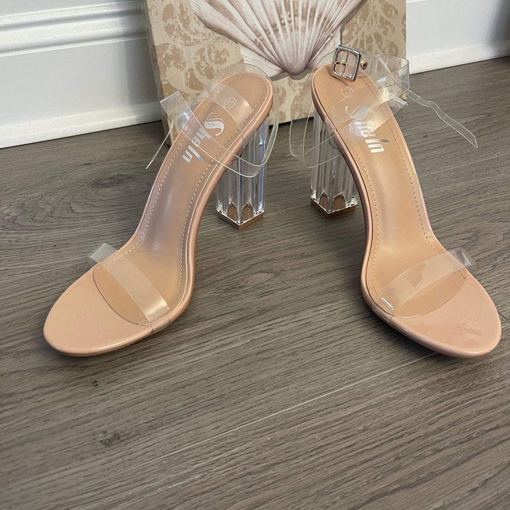 Clear strapped ankle and chunky high heels